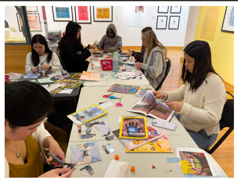 Image of students sitting around a table and cutting images out of magazines to create their own collage artwork